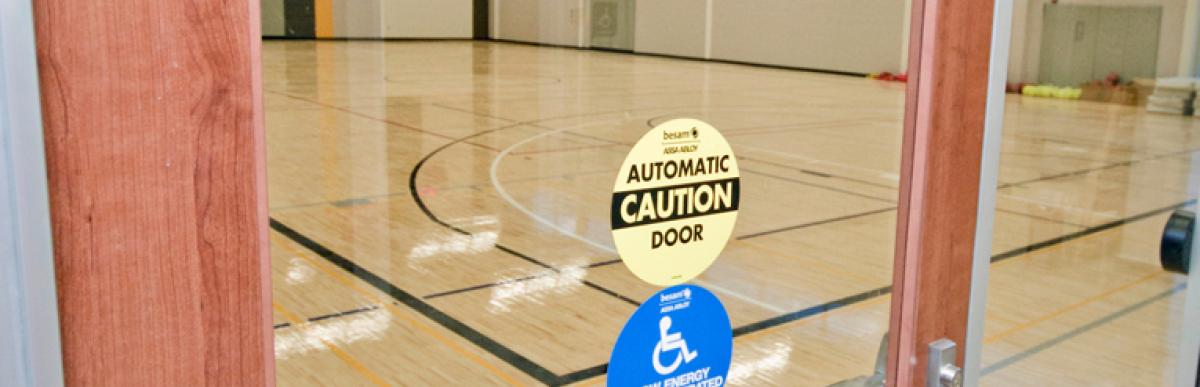 Accessible automatic door into a gym at a recreation centre in Hamilton