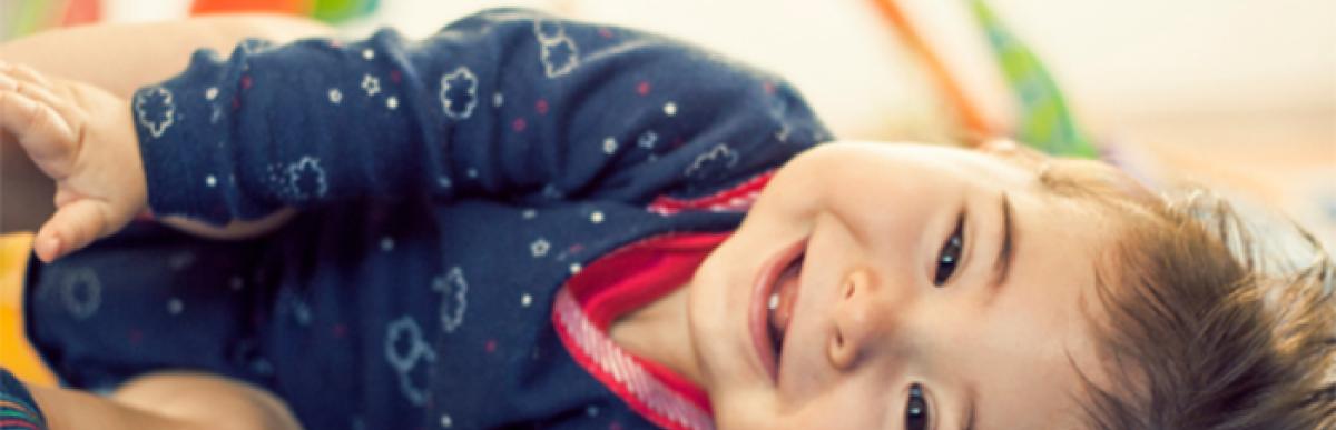 toddler laying on their side