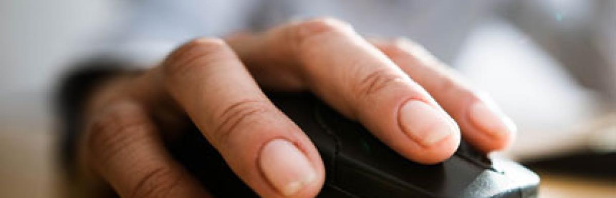Close up of a hand on a computer mouse