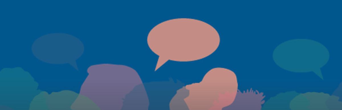 illustrated city skyline with profiles of peoples heads behind it