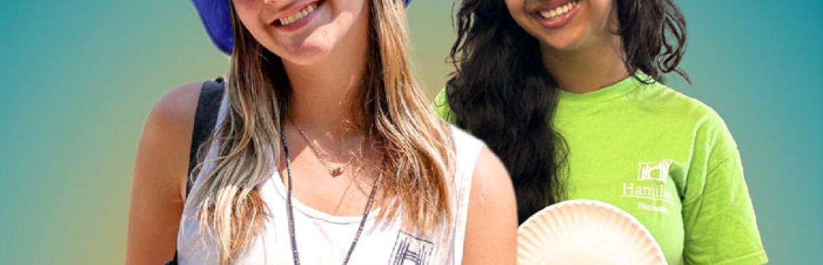 Two smiling teenage girls in Hamilton recreation shirts
