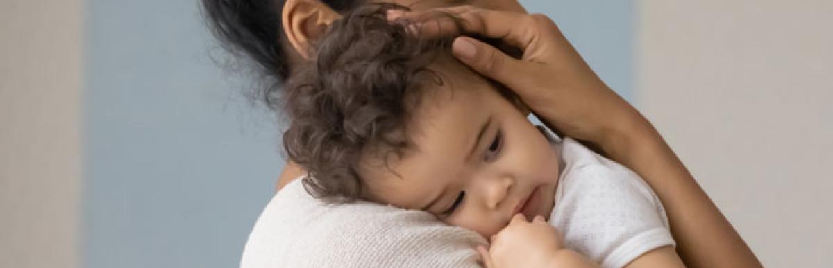 A woman holding a child in her arms