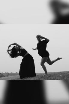 2 people posing outdoors