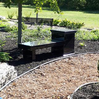 cremation bench along a walkway