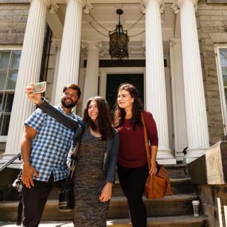 3 people taking a selfie on thefront steps or Whitehern Museum