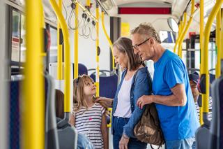 Older couple with young child on bus